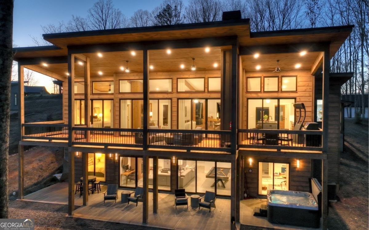 375 Blue Berry Ridge, Unit 2B Morganton, GA 30560 - Photo 55 of 61 a view of a room with lots of large windows and furniture
