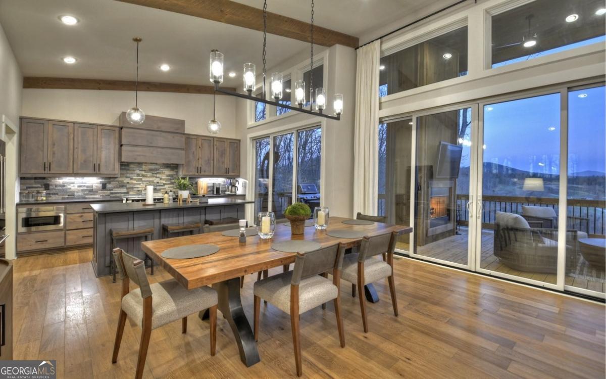 375 Blue Berry Ridge, Unit 2B Morganton, GA 30560 - Photo 56 of 61 a kitchen with a table and chairs in it