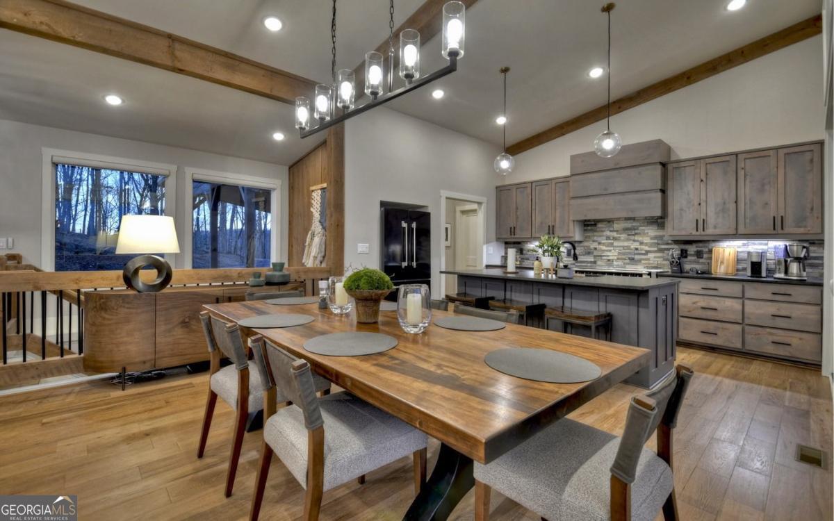375 Blue Berry Ridge, Unit 2B Morganton, GA 30560 - Photo 57 of 61 a kitchen with a table and chairs in it
