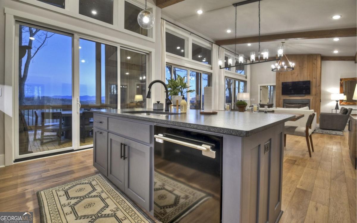 375 Blue Berry Ridge, Unit 2B Morganton, GA 30560 - Photo 59 of 61 a kitchen with stainless steel appliances granite countertop a stove a sink and a microwave