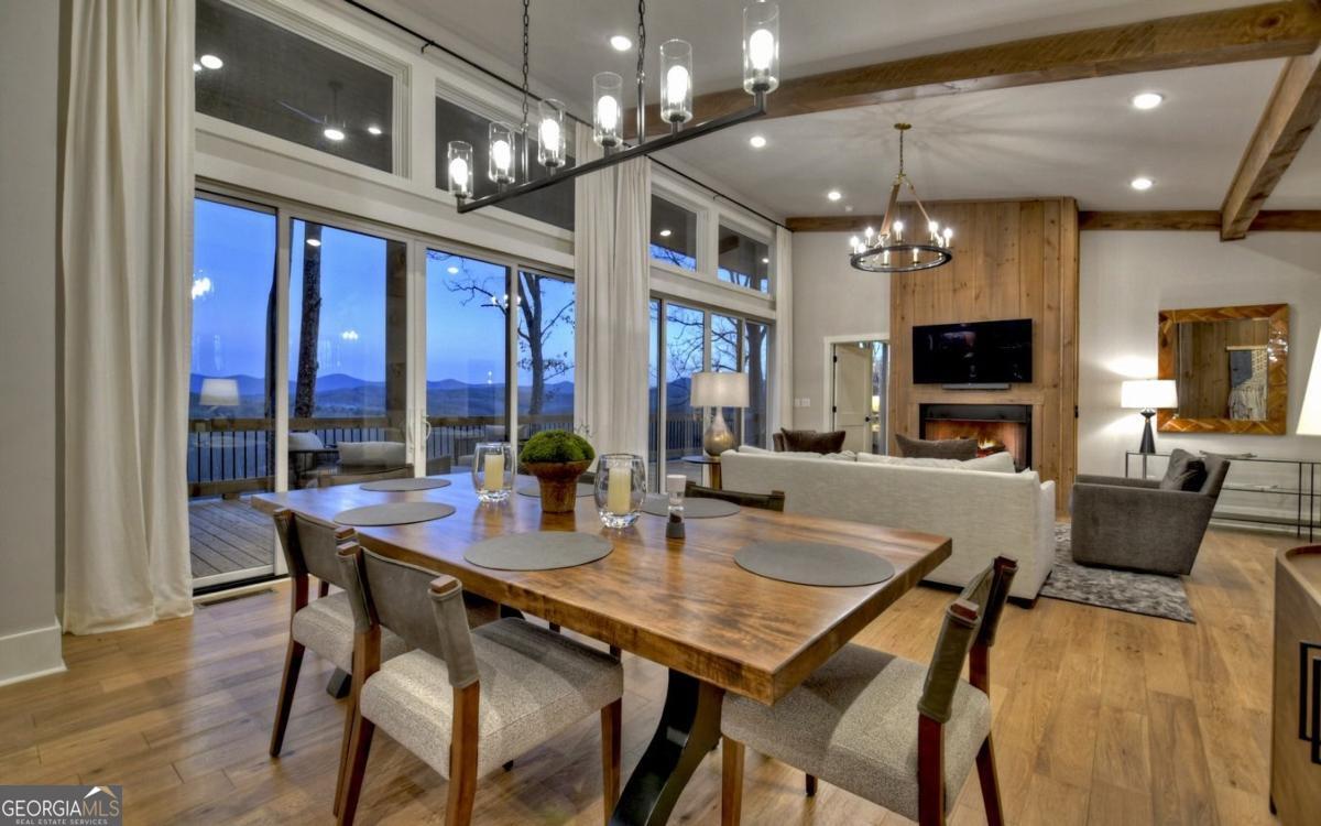 375 Blue Berry Ridge, Unit 2B Morganton, GA 30560 - Photo 6 of 61 a view of a dining room with furniture window and wooden floor