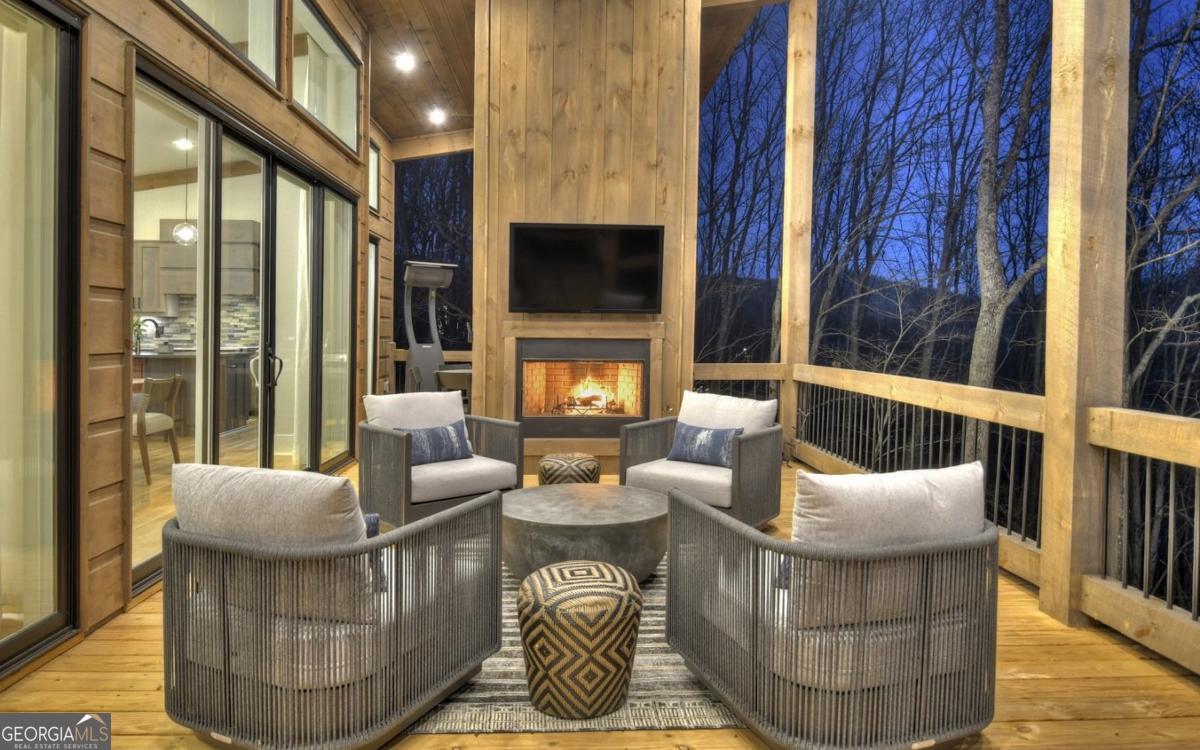 375 Blue Berry Ridge, Unit 2B Morganton, GA 30560 - Photo 7 of 61 a living room with furniture and a flat screen tv