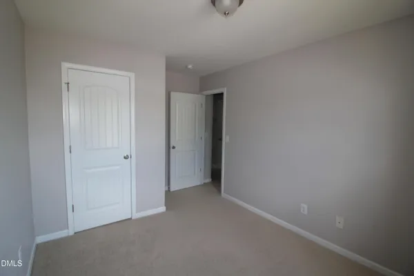 a bathroom with a shower a toilet and sink