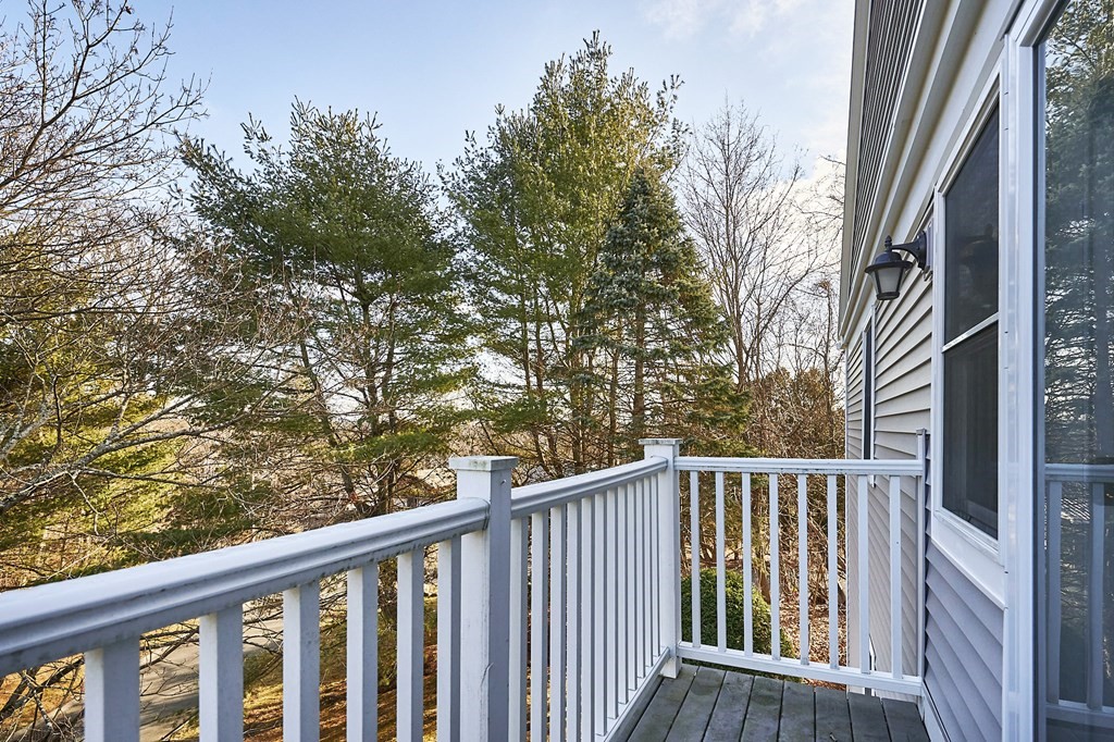 44 Evergreen Road, Unit 301 Leeds, MA 01053 - Photo 5 of 22 a view of a balcony with wooden fence and floor