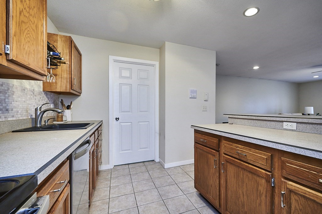 44 Evergreen Road, Unit 301 Leeds, MA 01053 - Photo 10 of 22 a kitchen with a sink and a refrigerator