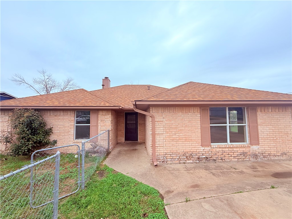 3831 Kendall Lane Waco, TX 76705 - Photo 2 of 13 a front view of a house with garden