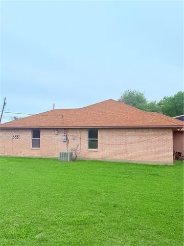 a house with garden in front of it