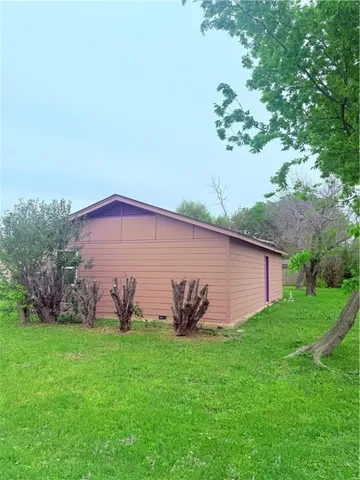 a backyard of a house with lots of green space
