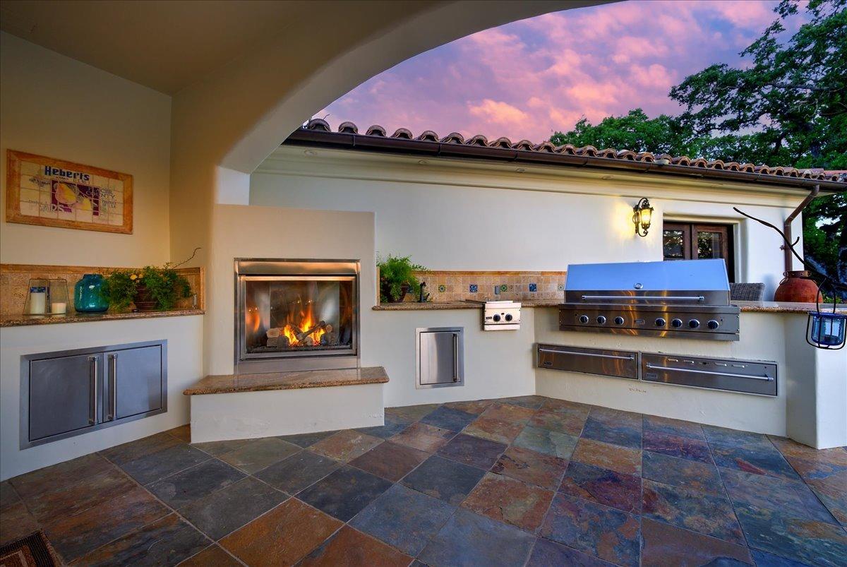 217 Rue Esperanza Lincoln, CA 95648 - Photo 11 of 71 Outdoor kitchen with Viking appliances and fireplace.
