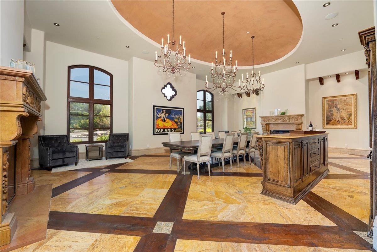 217 Rue Esperanza Lincoln, CA 95648 - Photo 15 of 71 Dining room is large enough for multiple dining tables. Dual stone fireplaces. Reclaimed wood and travertine flooring.