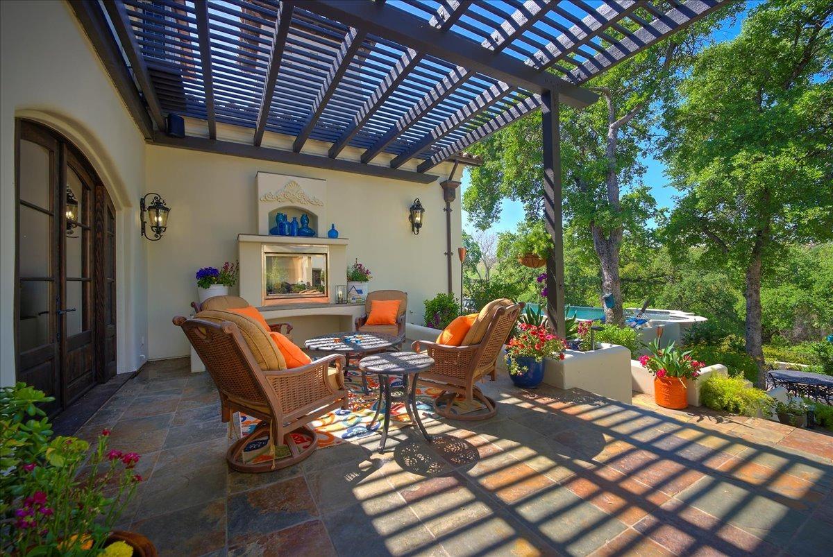 217 Rue Esperanza Lincoln, CA 95648 - Photo 20 of 71 Outdoor seating with fireplace off dining room.