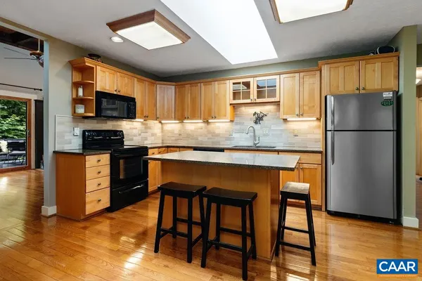 a dining room with furniture window wooden floor