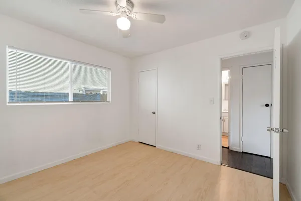 a view of an empty room with a window