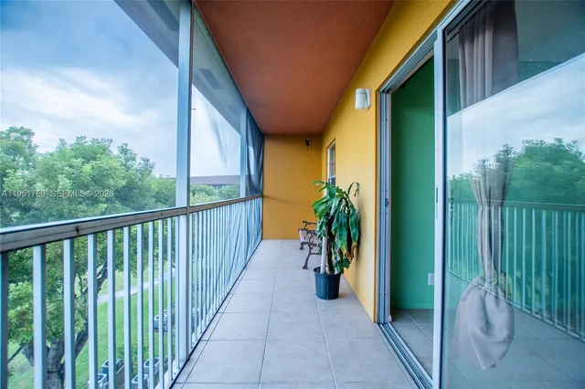 a view of a balcony with furniture