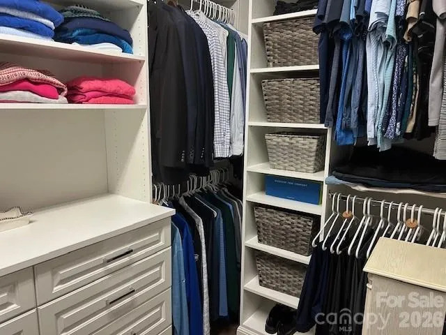 a bedroom with a bed and a closet