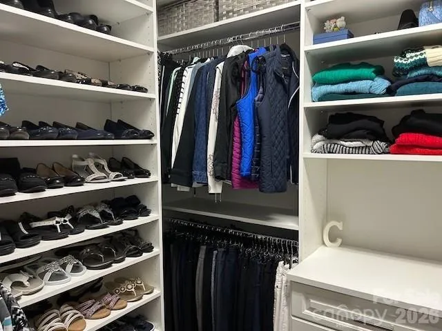 a living room with furniture a rug and a flat screen tv