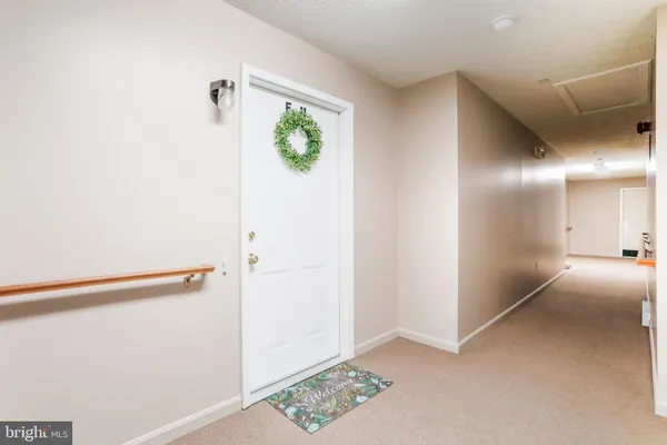 a view of hallway with livingroom