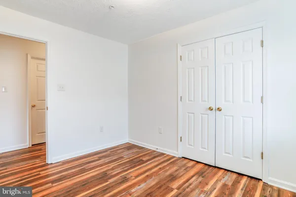 a view of a livingroom with wooden floor