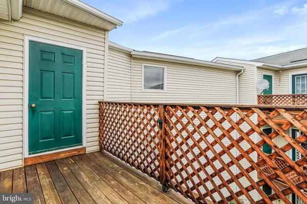 a backyard of a house with wooden fence