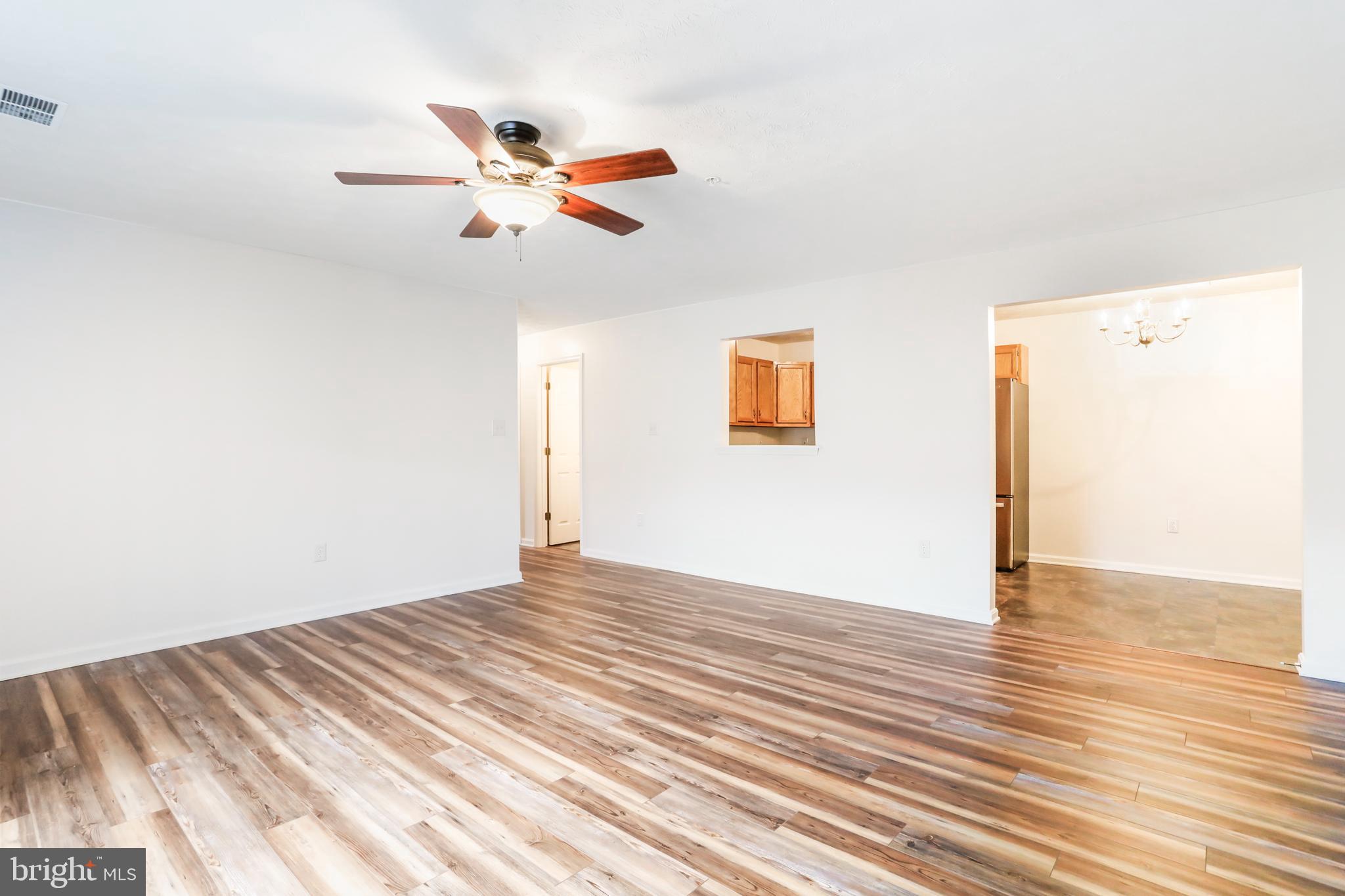145 Hailey Lane, Unit F11 Strasburg, VA 22657 - Photo 7 of 39 a view of empty room with wooden floor
