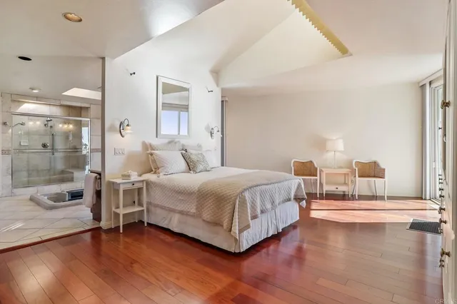 a bedroom with a bed and a view of bathroom