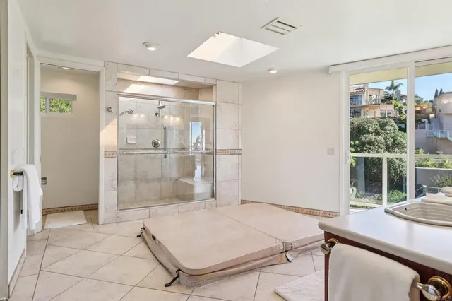a room with a table and glass door