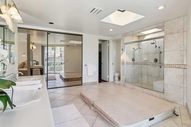 a bathroom with a shower and a sink