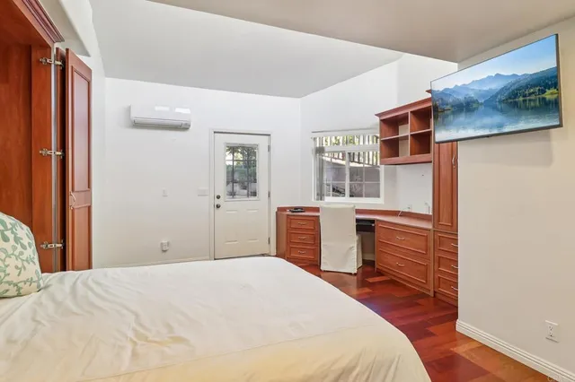 a bedroom with a bed and dresser