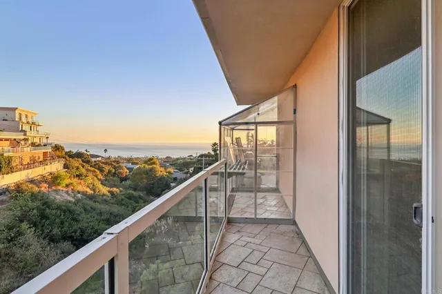 a view of a balcony with an outdoor space