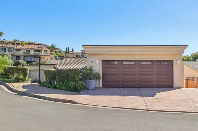 a view of a house with a street