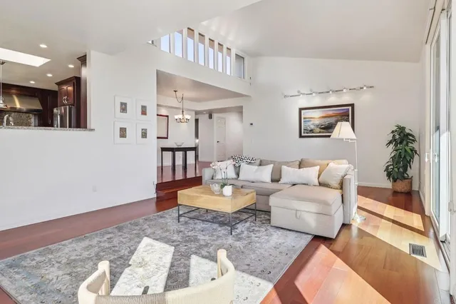 a living room with furniture and a rug