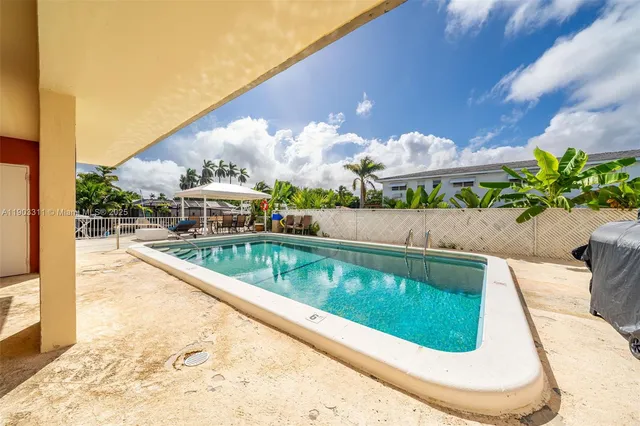 a view of a swimming pool with a patio