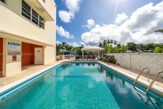 a view of a chair and tables the garden