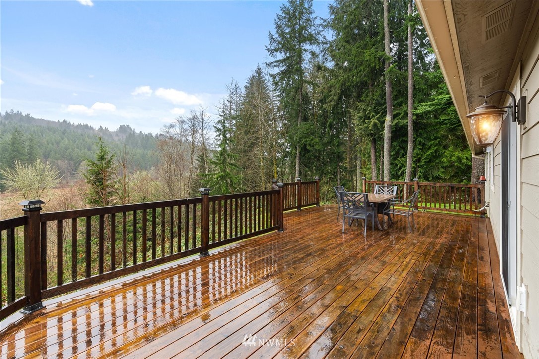 159 Salzer Road Centralia, WA 98531 - Photo 29 of 40 a view of balcony with wooden floor and outdoor seating