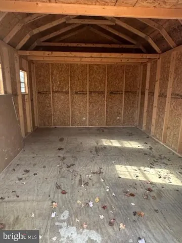 a backyard of a house with large trees