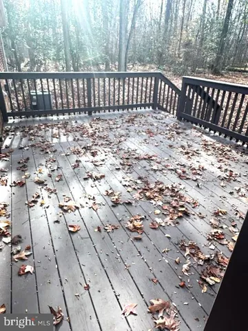 a view of balcony with wooden floor