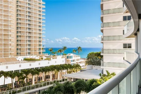 a view of building with an outdoor space and seating