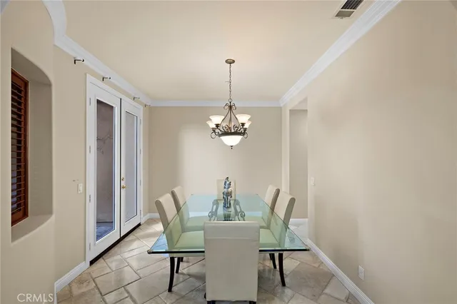 a living room with furniture and painting on the wall