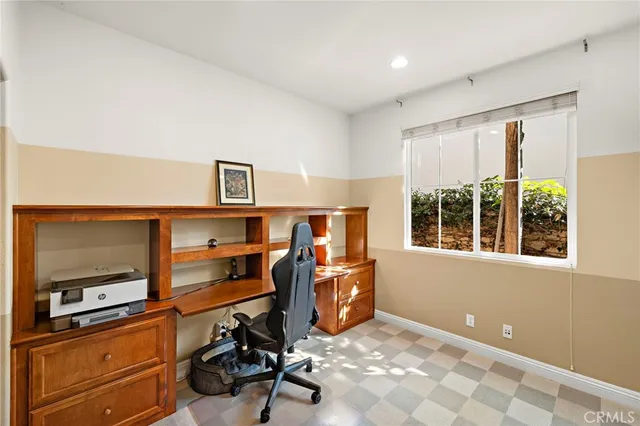 a bedroom with furniture and window