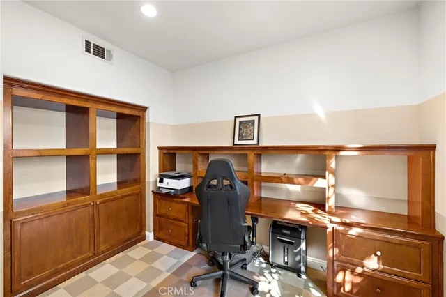 a bedroom with a bed and a night stand