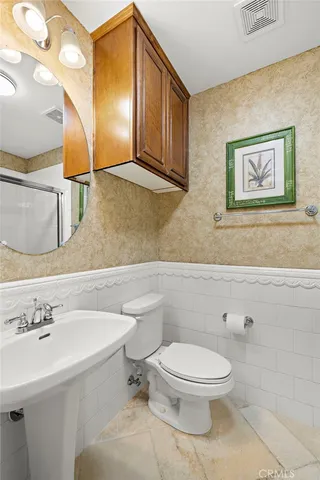 a bedroom with a bed and a tv