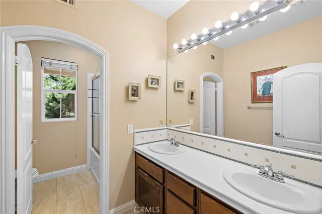 a white bench sitting in the middle of a yard