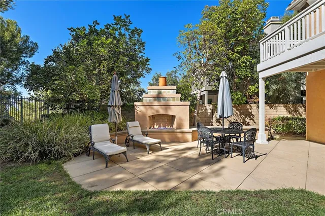 a backyard of a house with a garden and plants