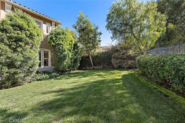 an aerial view of a house with a yard swimming pool