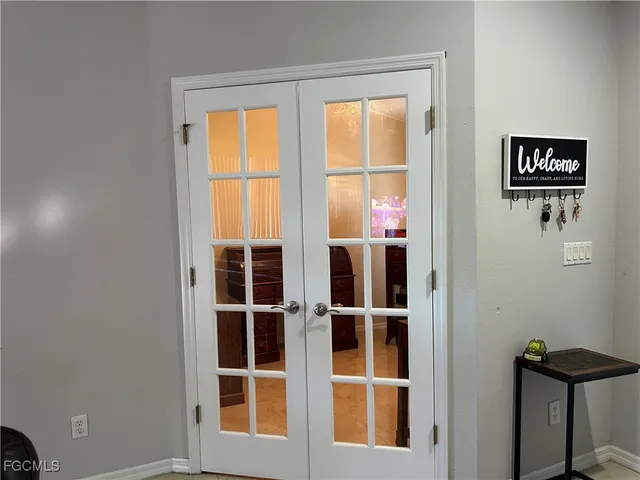 a view of a dining room with furniture and window