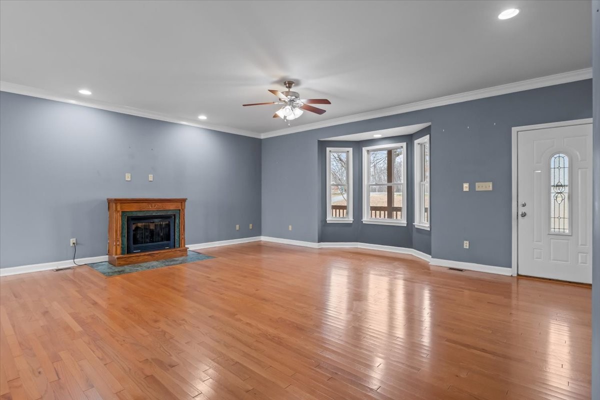 1077 Claylick Road White Bluff, TN 37187 - Photo 17 of 49 a view of an empty room with a fireplace and a window