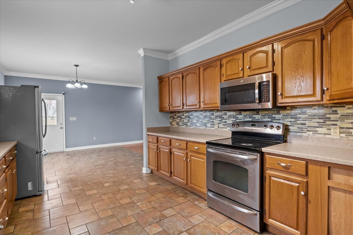 1077 Claylick Road White Bluff, TN 37187 - Photo 21 of 49 a kitchen with stainless steel appliances granite countertop a stove sink microwave and refrigerator