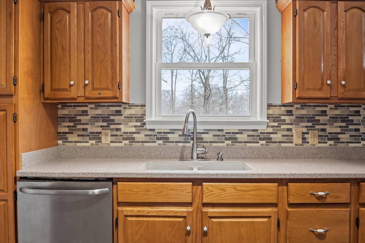 1077 Claylick Road White Bluff, TN 37187 - Photo 23 of 49 a kitchen with stainless steel appliances granite countertop a sink and a window