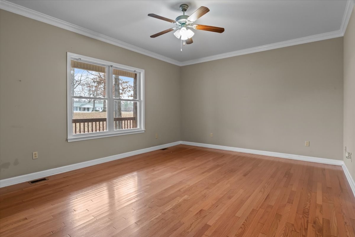 1077 Claylick Road White Bluff, TN 37187 - Photo 25 of 49 a view of an empty room with wooden floor and a window