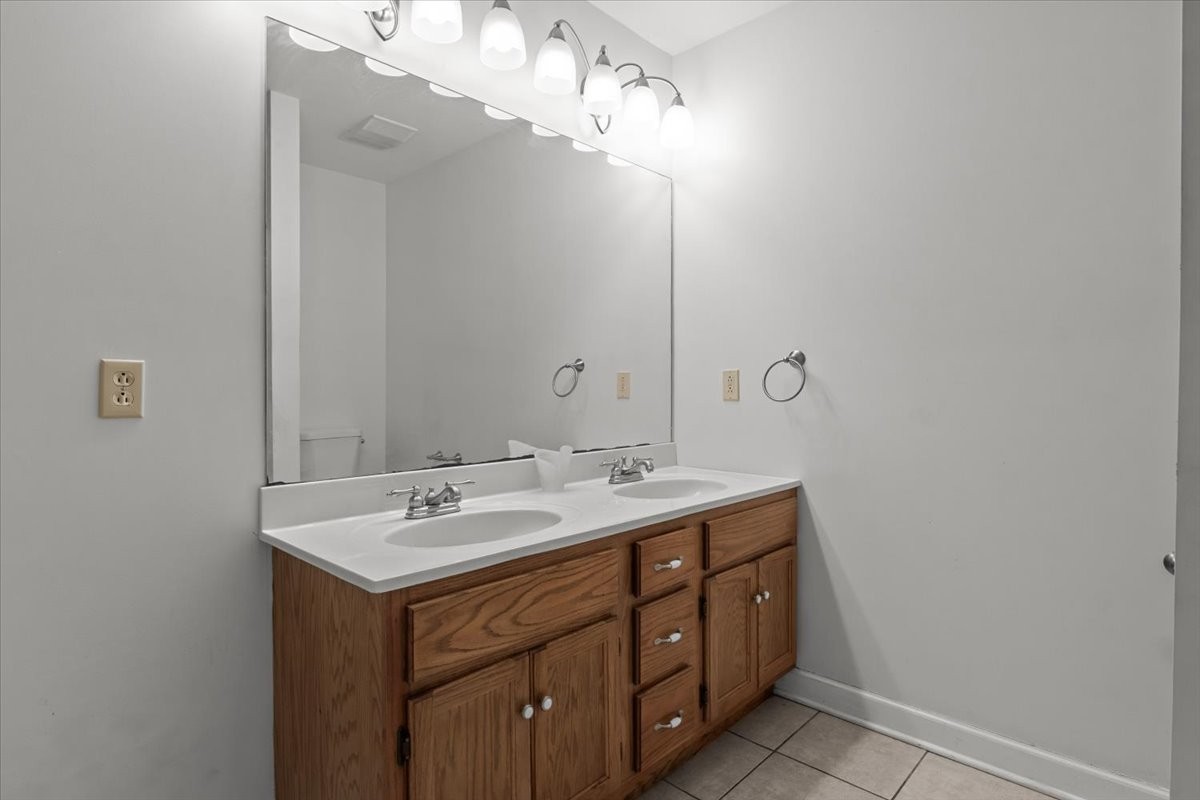1077 Claylick Road White Bluff, TN 37187 - Photo 37 of 49 a bathroom with a sink a light fixture and a mirror